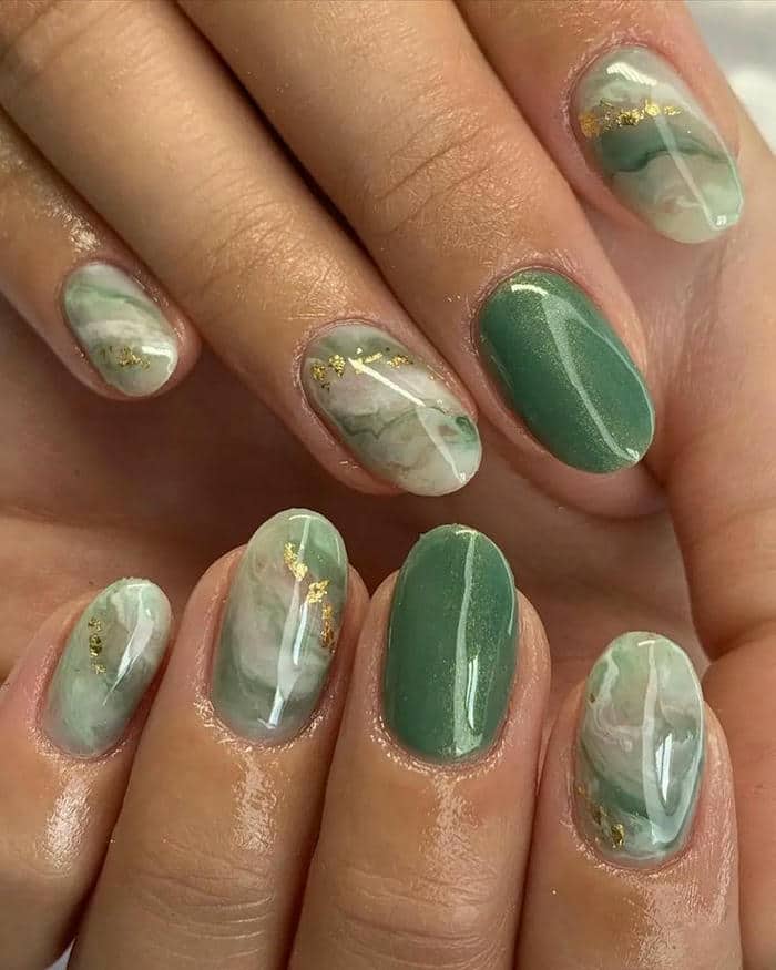 ảnh mẫu nail màu xanh ngọc đính đá
